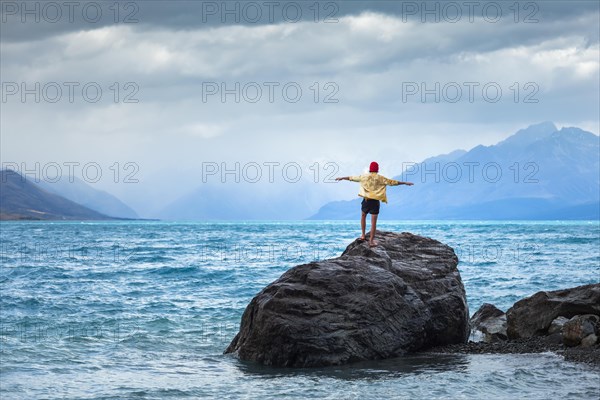 Guy at a beach at Lake Tekapo