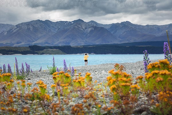 Guy at a beach at Lake Tekapo