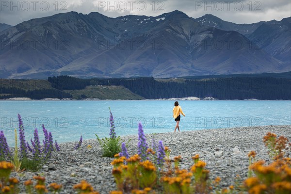 Guy at a beach at Lake Tekapo