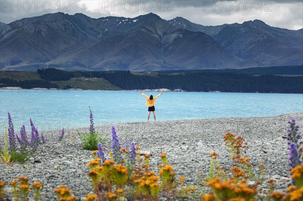 Guy at a beach at Lake Tekapo