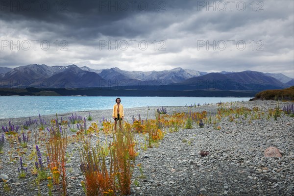 Guy at a beach at Lake Tekapo