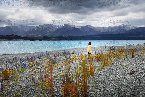 Guy at a beach at Lake Tekapo