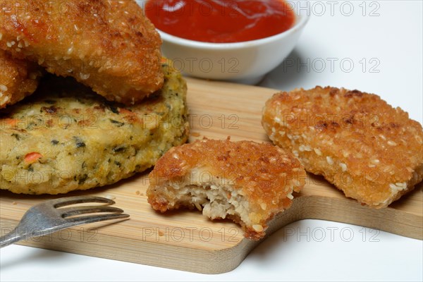 Meat substitute on wooden board with fork