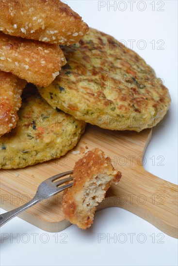 Meat substitute on wooden board with fork