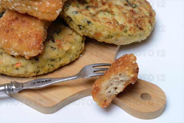 Meat substitute on wooden board with fork