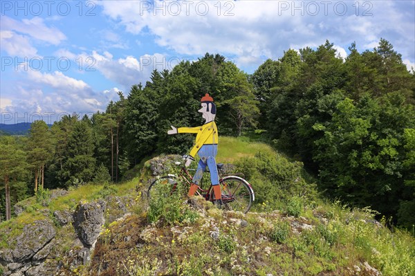 Aerial view of the rock above Oberailsfeld with cyclist figure