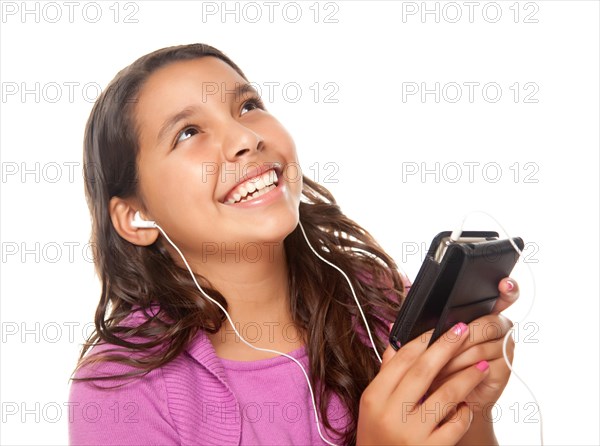 Pretty hispanic girl listening and dancing to music isolated on a white background