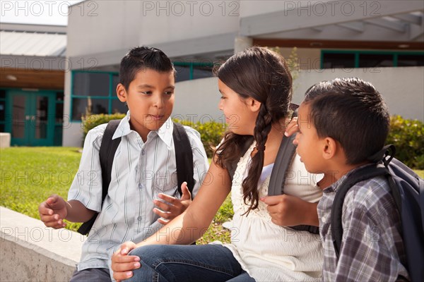 Cute brothers and sister talking