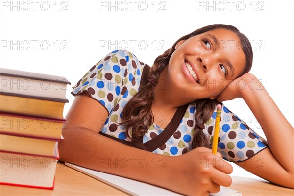 Pretty hispanic girl daydreaming while studying isolated on a white background