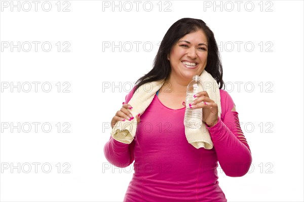 Attractive middle aged hispanic woman in workout clothes with water bottle and towel against a white background