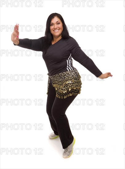 Attractive hispanic woman dancing zumba on a white background