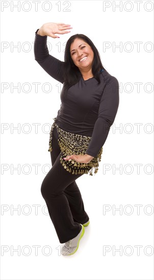 Attractive hispanic woman zumba dancing on a white background