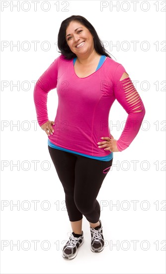 Attractive middle aged hispanic woman in workout clothes against a white background