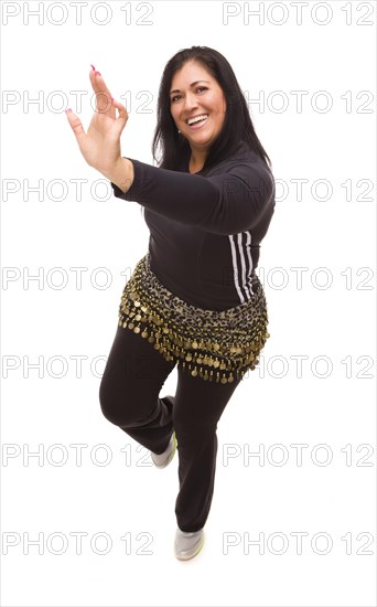 Attractive hispanic woman dancing zumba on a white background