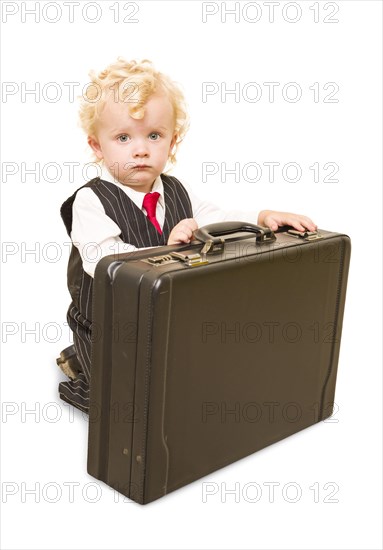 Cute boy in vest suit and tie with briefcase on white