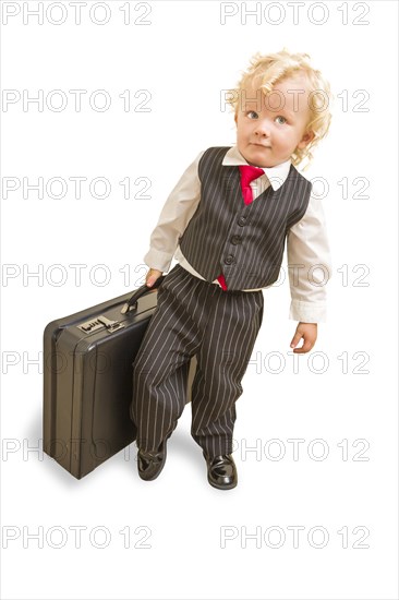 Cute boy in vest suit and tie with briefcase on white