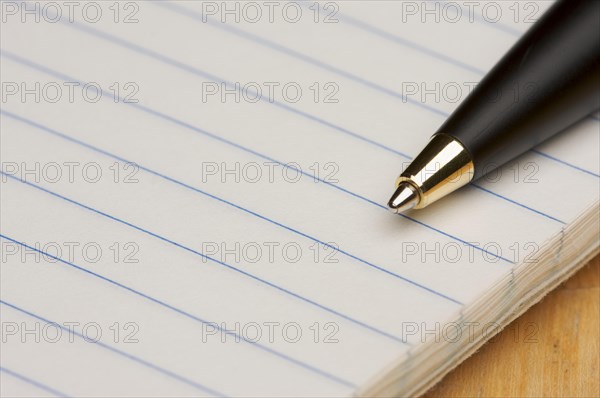 Pen and pad of lined paper