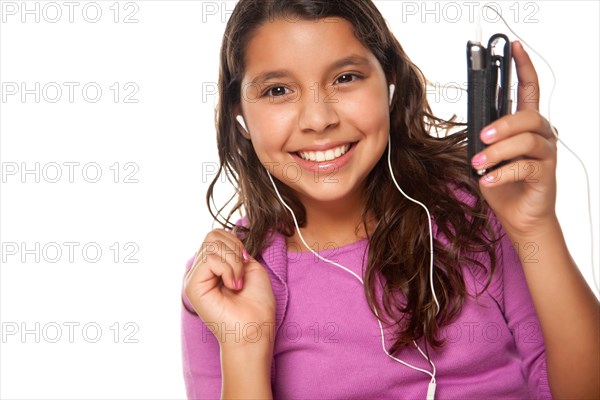 Pretty hispanic girl listening and dancing to music isolated on a white background