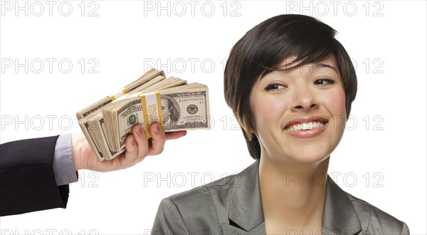mixed-race young woman being handed thousands of dollars isolated on a white background