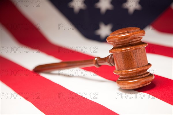 Justice gavel resting on an american flag