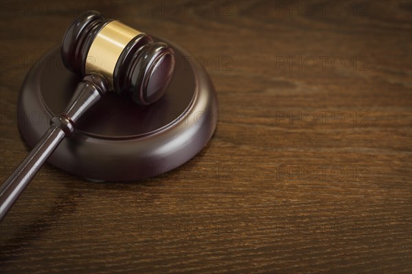 Dark wooden gavel abstract on table with room for text