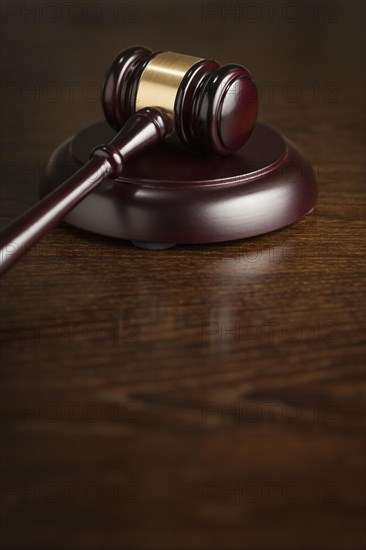 Dark wooden gavel abstract on table with room for text