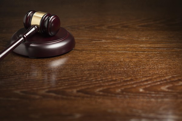 Dark wooden gavel abstract on table with room for text