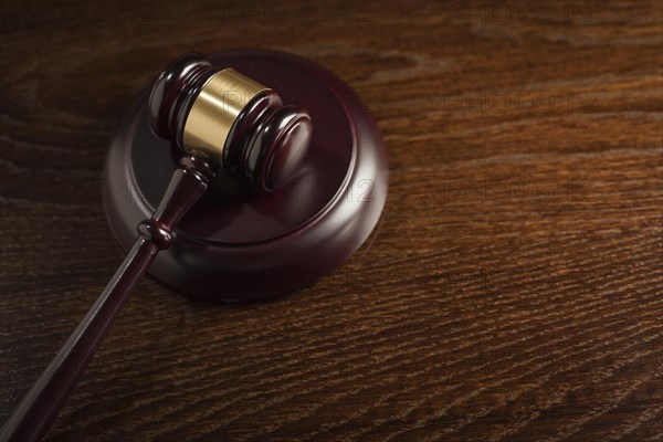 Dark wooden gavel abstract on table with room for text