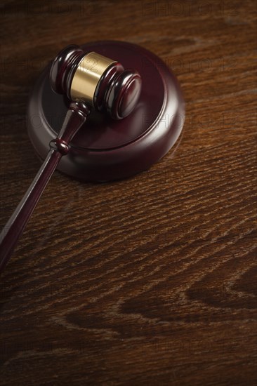 Dark wooden gavel abstract on table with room for text