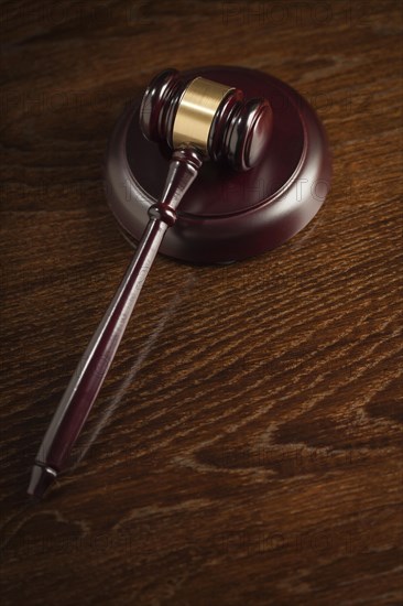 Dark wooden gavel abstract on table with room for text