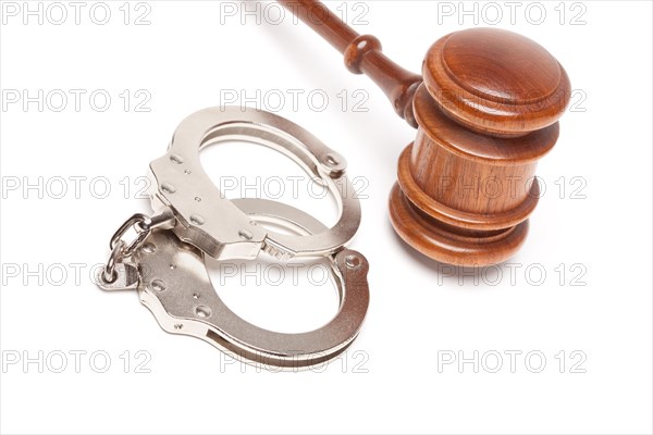 Gavel and handcuffs isolated on a white background