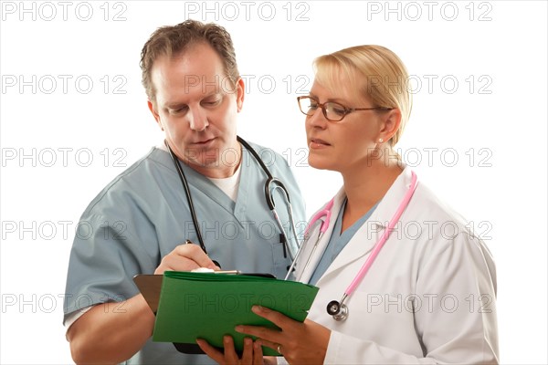 Male and female doctors looking over files isolated on a white background