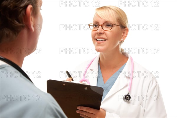 Male and female doctors talking over file