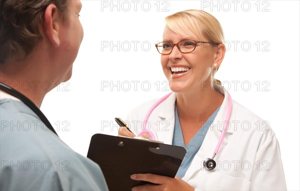 Male and female doctors talking over file