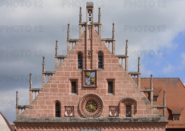 Town hall gable with town hall clock and town coat of arms of the historical town hall