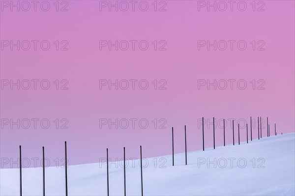Electricity pylons in winter landscape