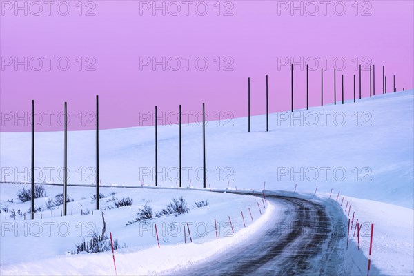 Electricity pylons in winter landscape