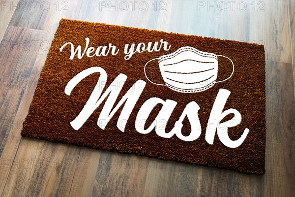 Wear your mask welcome door mat on wood floor