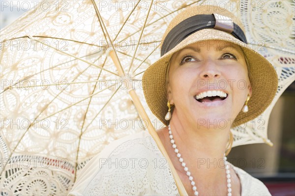 Beautiful 1920s dressed girl with parasol portrait