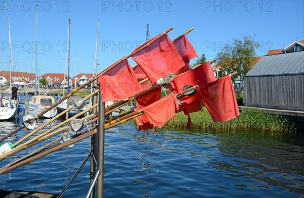 Red fishing flags at the seaside resort of Rerk