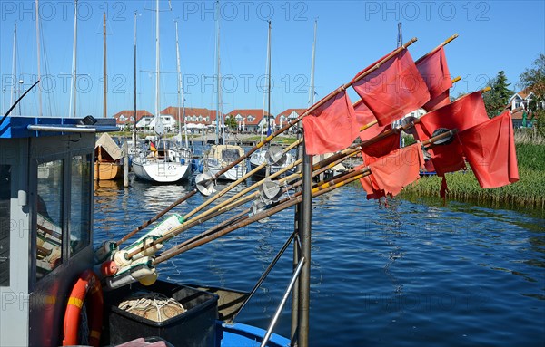Red fishing flags at the seaside resort of Rerk