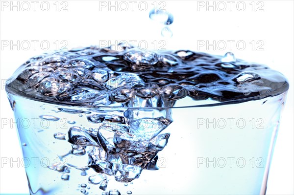 Glass filled with bubbling water