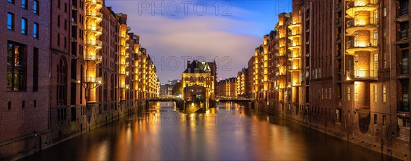 Moated castle Speicherstadt castle panorama at night in Hamburg