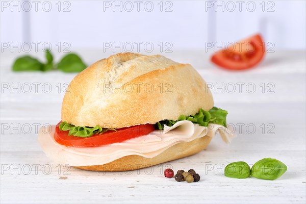 Roll Sandwich Baguette topped with ham on wooden board in Germany