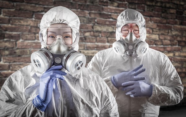 Chinese woman and man in gas masks