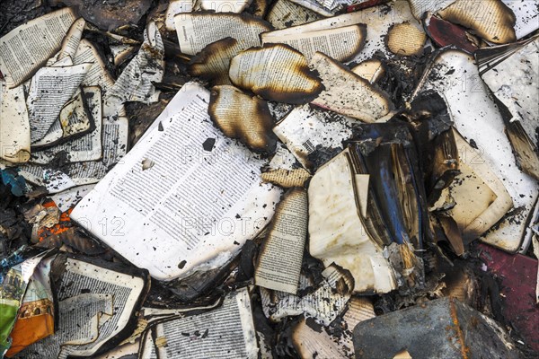 Charred remains of books after arson