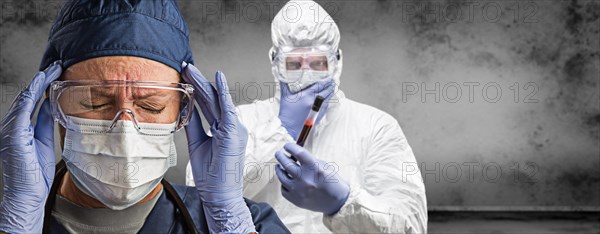 Female and male doctors or nurses wearing scrubs and protective mask and goggles banner