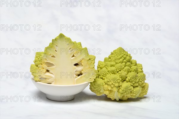 Halved cauliflower Romanesco on a decorative plate