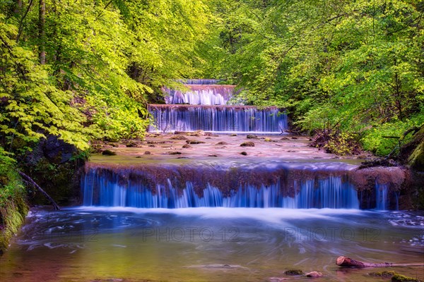 Village stream with waterfalls