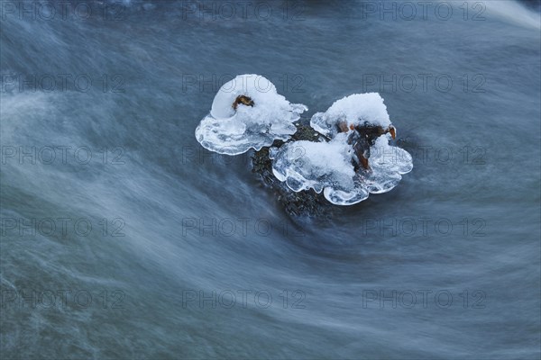 Icicles on wild river in nature reserve Hoelle